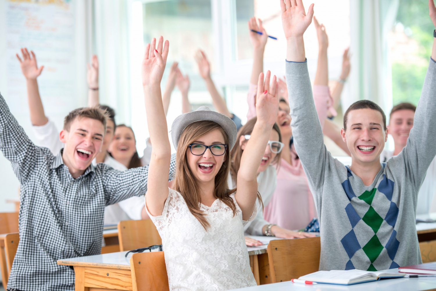 cheerful-students-waving-arms