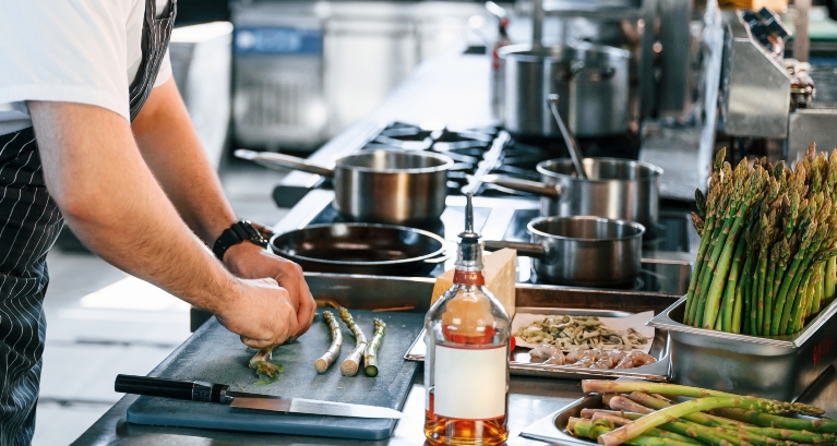 slicing-cutting-asparagus-chef-is-kitchen-preparing-food